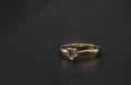 Diamond ring in a dark box. golden gold ring with on black background Royalty Free Stock Photo