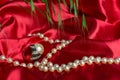 Diamond ring with pearls red background and grass Royalty Free Stock Photo