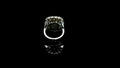 Diamond ring with red gem rotating on black background. 3D render animation of diamond ring. Motion graphics rendering of a