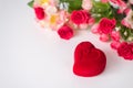 Diamond ring in a red heart-shaped box with flowers on a white background. Space for text. Birthday, Valentine`s, engagement, Royalty Free Stock Photo