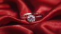 Diamond ring on the red silk background in focus. Royalty Free Stock Photo