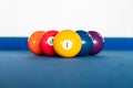 Diamond shape of 9-ball pool balls placed in rack position on blue felt table Royalty Free Stock Photo
