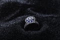 Diamond Shape Silver Ring With Blue Gemstones On Black Sand