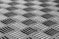 Diamond shaped metal floor pattern with blur effect in black and Royalty Free Stock Photo