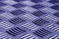 Diamond shaped metal floor pattern with blur effect in blue tone Royalty Free Stock Photo