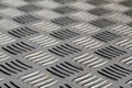 Diamond shaped metal floor pattern with blur effect. Royalty Free Stock Photo