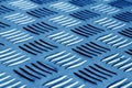 Diamond shaped metal floor pattern with blur effect in navy blue Royalty Free Stock Photo