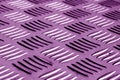 Diamond shaped metal floor pattern with blur effect in purple to Royalty Free Stock Photo