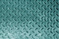 Diamond shaped metal floor pattern in cyan tone. Royalty Free Stock Photo