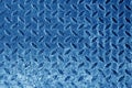 Diamond shaped metal floor pattern in navy blue tone. Royalty Free Stock Photo