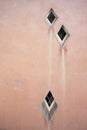Diamond-shaped windows in a vintage wall of a house in Barcelona Royalty Free Stock Photo