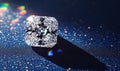 A diamond is sitting on a blue surface Royalty Free Stock Photo