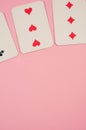 3 of diamonds, hearts, and clubs poker cards on a pink background with free space for text
