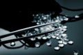 Diamonds scattered on a shiny surface Royalty Free Stock Photo