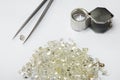 Diamonds, tweezers and loupe Royalty Free Stock Photo