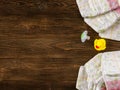 diapers and dummy and rubber duckling on wooden background Royalty Free Stock Photo