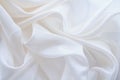 Diaphanous white fabric draped with folds, textile wave background