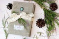 Diary book with bunch of erica and piny cones