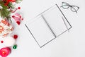 Diary christmas composition. fir branches and christmas decorations on white background. flat lay top view.