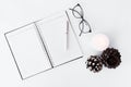 Diary christmas composition. stylish arrangement of cones and candle on white background. flat lay top view.