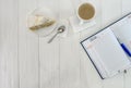Diary with cup of coffee and piece of cake Royalty Free Stock Photo