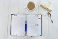 Diary with cup of coffee and piece of cake Royalty Free Stock Photo