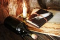 Diary and feather with a bottle of rum Royalty Free Stock Photo