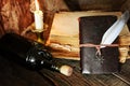 Diary and feather with a bottle of rum Royalty Free Stock Photo