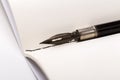 Old fountain pen with clipping path write on white paper background Royalty Free Stock Photo