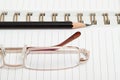 A diary with a pencil and glasses Royalty Free Stock Photo