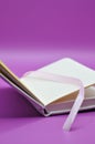 diary on purple background Royalty Free Stock Photo