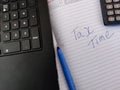 A diary with text TAX TIME and calculator,pen Royalty Free Stock Photo
