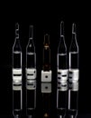 Dice with ampoules on a black background