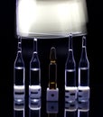 Dice with ampoules on a black background, drawing with light