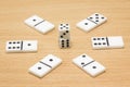 Dice around which lies dominoes