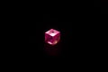 Red dice on black background, decorative red dice on black, light switch on black Royalty Free Stock Photo