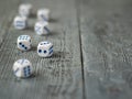 Dice blue and white color on wooden rustic table.