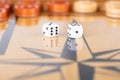 Dice and checkers on a wooden backgammon board