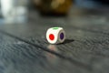 Dice with colored dots on the table Royalty Free Stock Photo