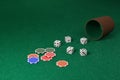 Dice and dice cup and chips on a green cloth. 3d illustration Royalty Free Stock Photo