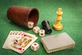 Dice Cup with Deck Cards and Chess Pieces Royalty Free Stock Photo