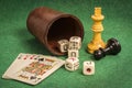 Dice Cup with Deck Cards and Chess Pieces Royalty Free Stock Photo