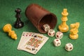 Dice Cup with Deck Cards and Chess Pieces Royalty Free Stock Photo