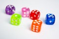 Dice of different colors isolated on a white background. Royalty Free Stock Photo