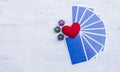 Dice divination with tarot card and red heart with space on wood background