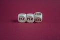 Dice form the expressions pay per view and pay per click. Beautiful red background Royalty Free Stock Photo