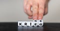 Dice form the German words `Krieg` war and `Krise` crisis. Royalty Free Stock Photo