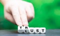 Dice form the words `Lust` and `Trust`.