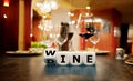 Dice form the words wine and dine in a restaurant.