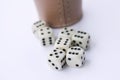 Dice game with dice cup on white table casino concept